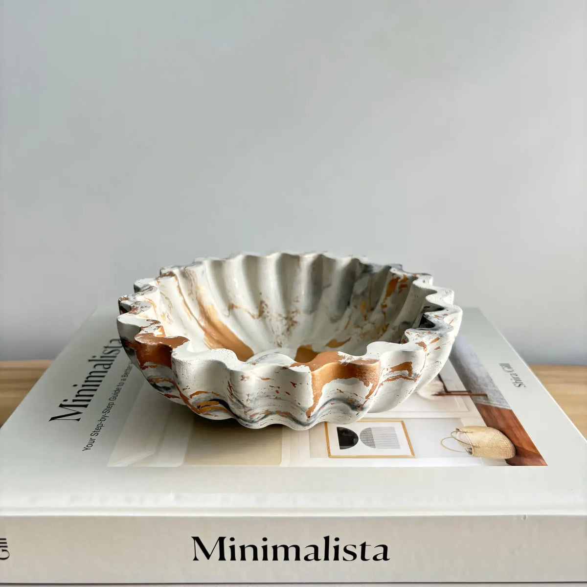 White, black, and gold marble concrete ruffle bowl