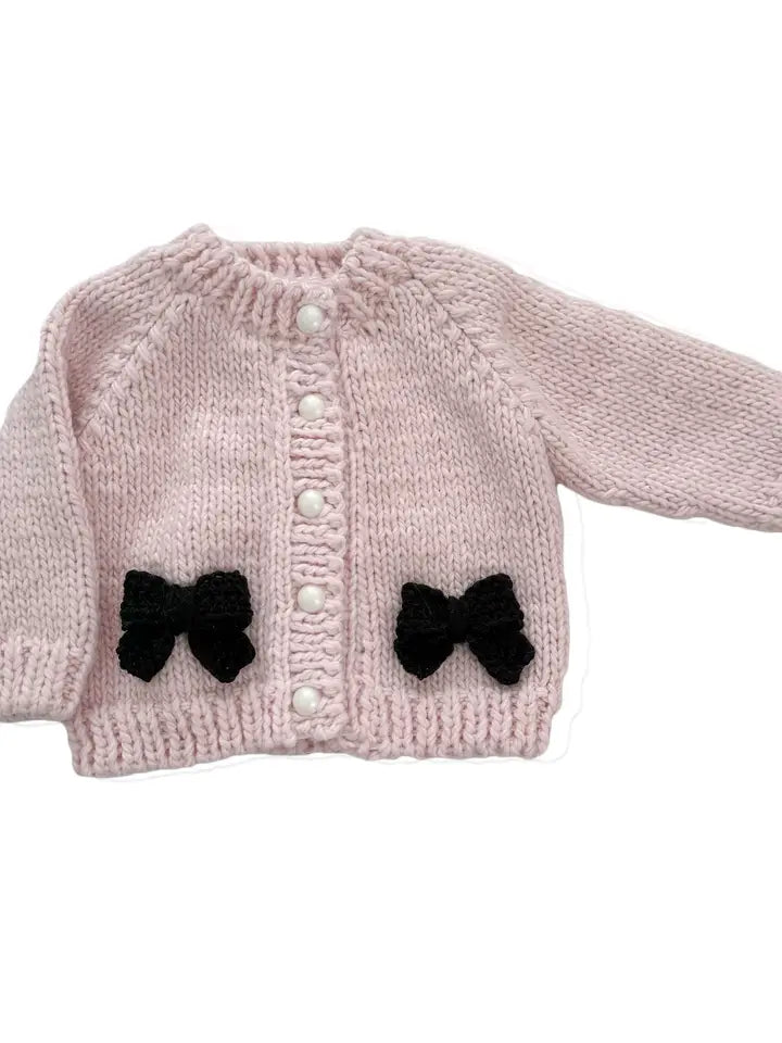 Cardigan rose et noir avec nœud pour bébé