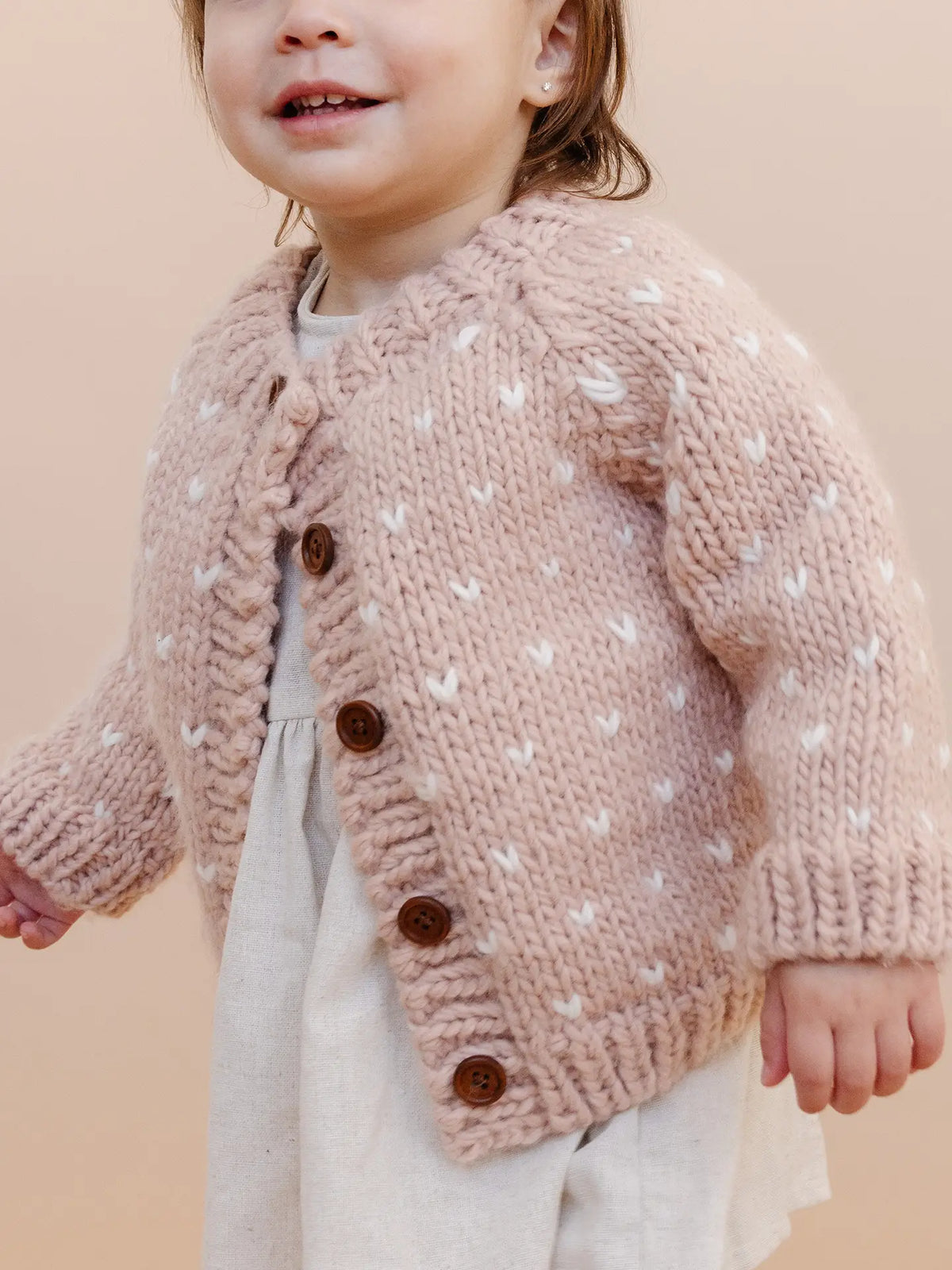 Gilet bébé rose à cœur